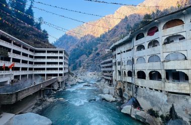 Beautiful river view with buildings and mountains in Manikaran, HP, India.